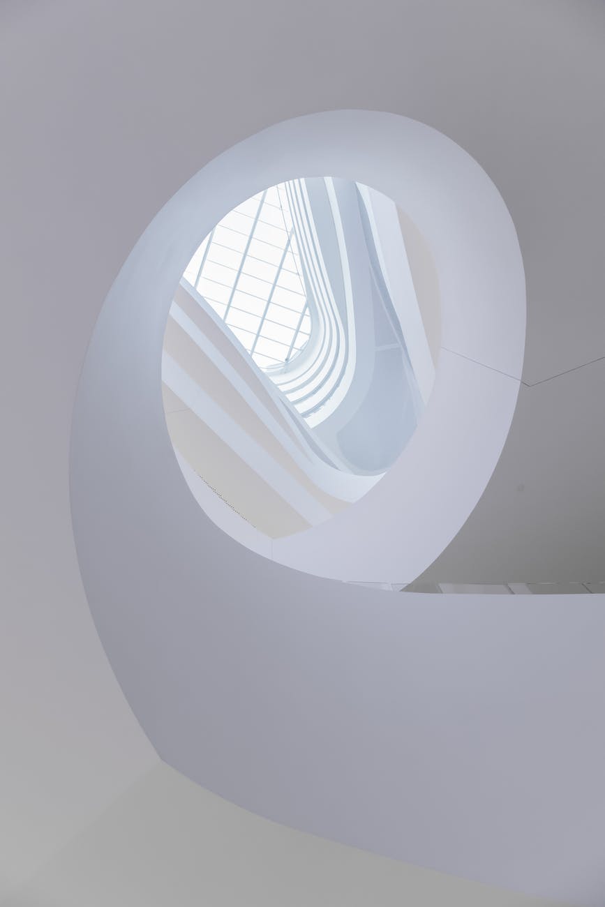 white concrete spiral staircase